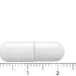 En enkelt hvid Vitakruid - Symflora® Original (90 vega kapsler) kapselformet pille mod en almindelig baggrund.