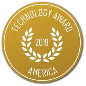 Logoet er en guldcirkel med "TECHNOLOGY AWARD 2019 AMERICA" i hvidt omkring et laurbærkransdesign. Produkt: Vitakruid – Curcuma C3-2X (60 veganske kapsler).